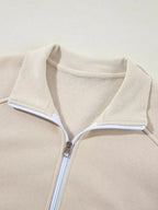 Women's drop shoulder zip-up hoodie and jogger lounge set by Trendsi, featuring a cozy sweat suit with relaxed fit and casual style.