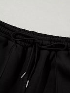 Women’s drop shoulder zip-up jacket and jogger lounge set, two-piece sweat suit by Trendsi, featuring a relaxed fit and comfortable fabric.