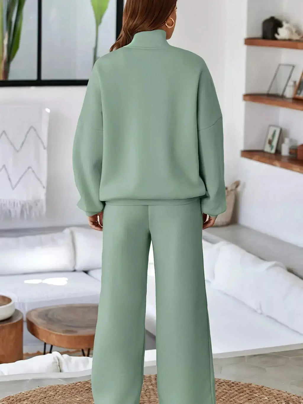 Women's drop shoulder zip-up jacket and matching jogger lounge set, stylish sweat suit by Trendsi.