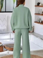Women's drop shoulder zip-up jacket and matching jogger lounge set, stylish sweat suit by Trendsi.
