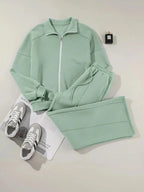 Women's drop shoulder zip-up jacket and jogger sweat suit two-piece lounge set by Trendsi, featuring a cozy, casual fit.