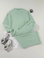 Women's drop shoulder zip-up jacket and jogger lounge set, comfortable sweat suit in neutral fabric, casual trendy activewear.