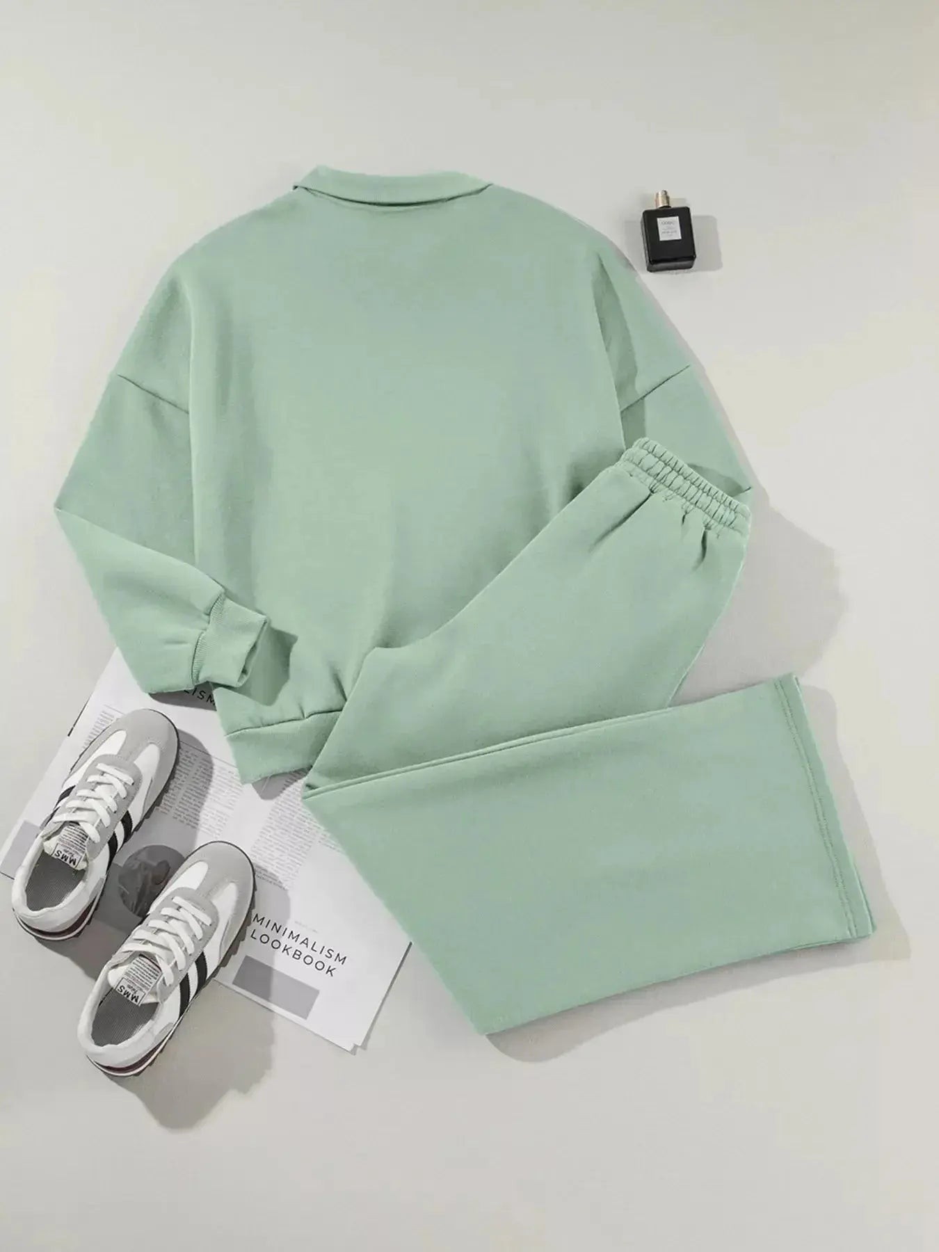 Women's drop shoulder zip-up jacket and jogger lounge set, comfortable sweat suit in neutral fabric, casual trendy activewear.