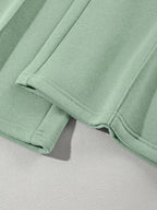 Women's drop shoulder zip-up jacket and jogger lounge set by Trendsi, stylish two-piece sweat suit with comfortable fit.
