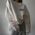 Women wearing a soft round neck casual sweater by Plush Fashion Hub, featuring a cozy fit and smooth fabric in a relaxed style.