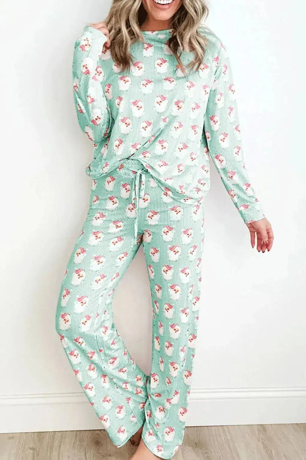 Women's festive Santa print long sleeve pajama lounge set by Plush Fashion Hub, featuring cozy holiday-themed pajamas.