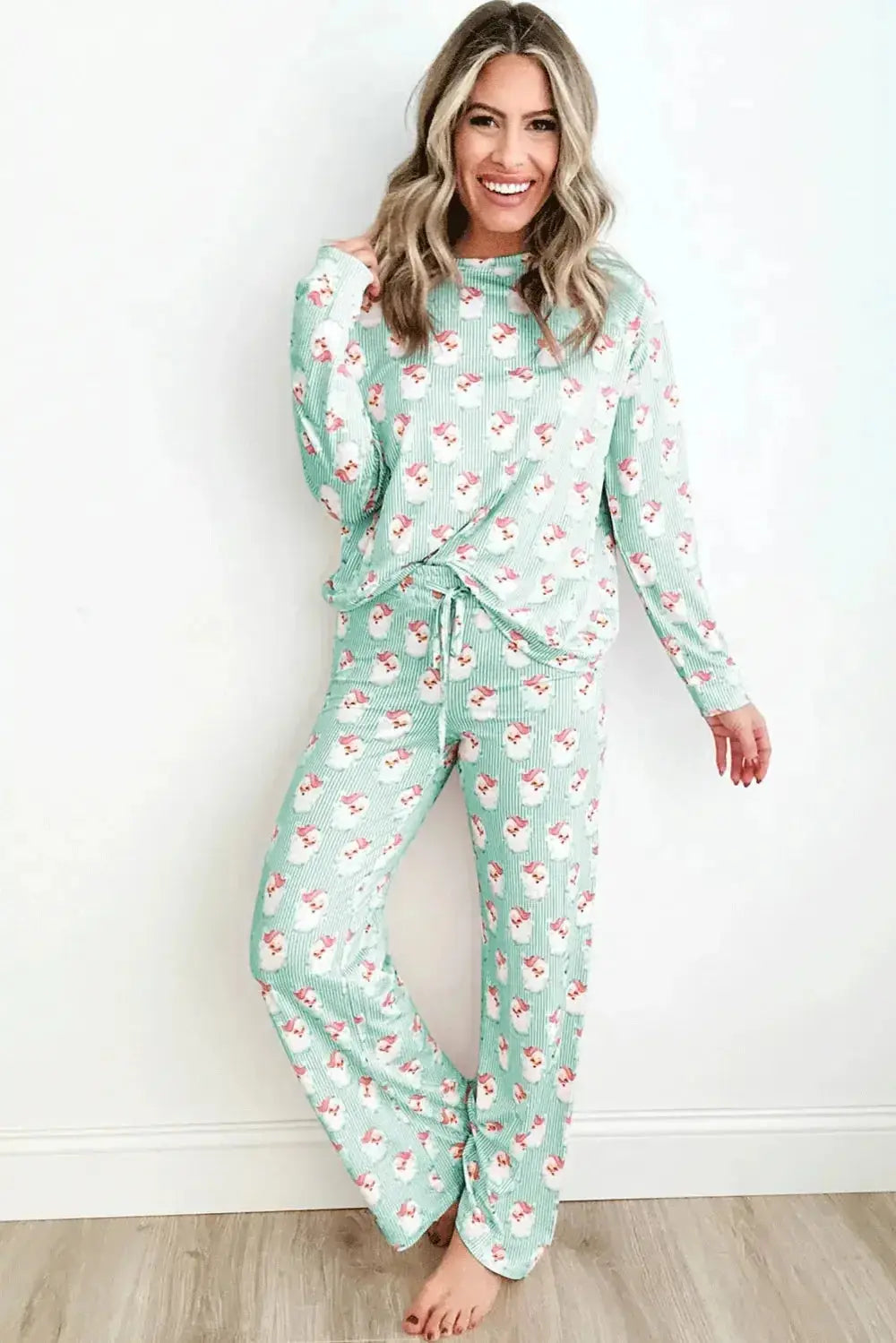 Women's festive Santa print long sleeve pajama lounge set by Plush Fashion Hub, featuring cozy holiday-themed pajamas with a Santa design.