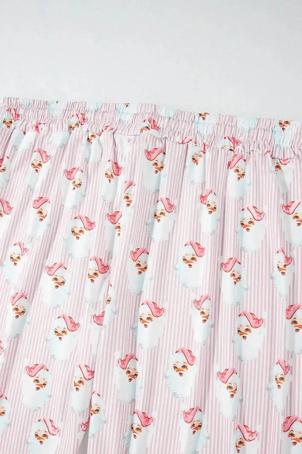 Women's festive Santa print long sleeve pajama lounge set by Plush Fashion Hub, featuring cozy holiday-themed pajamas.