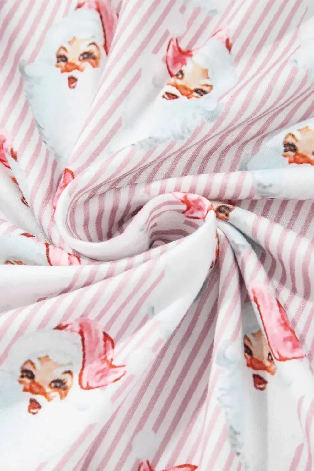 Women's festive Santa print long sleeve pajama lounge set by Plush Fashion Hub, featuring cozy holiday-themed pajamas with Santa design.