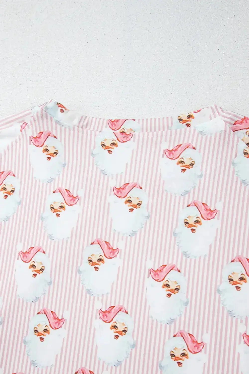 Women's festive Santa print long sleeve pajamas lounge set by Plush Fashion Hub, featuring cozy holiday-themed sleepwear with Santa design.