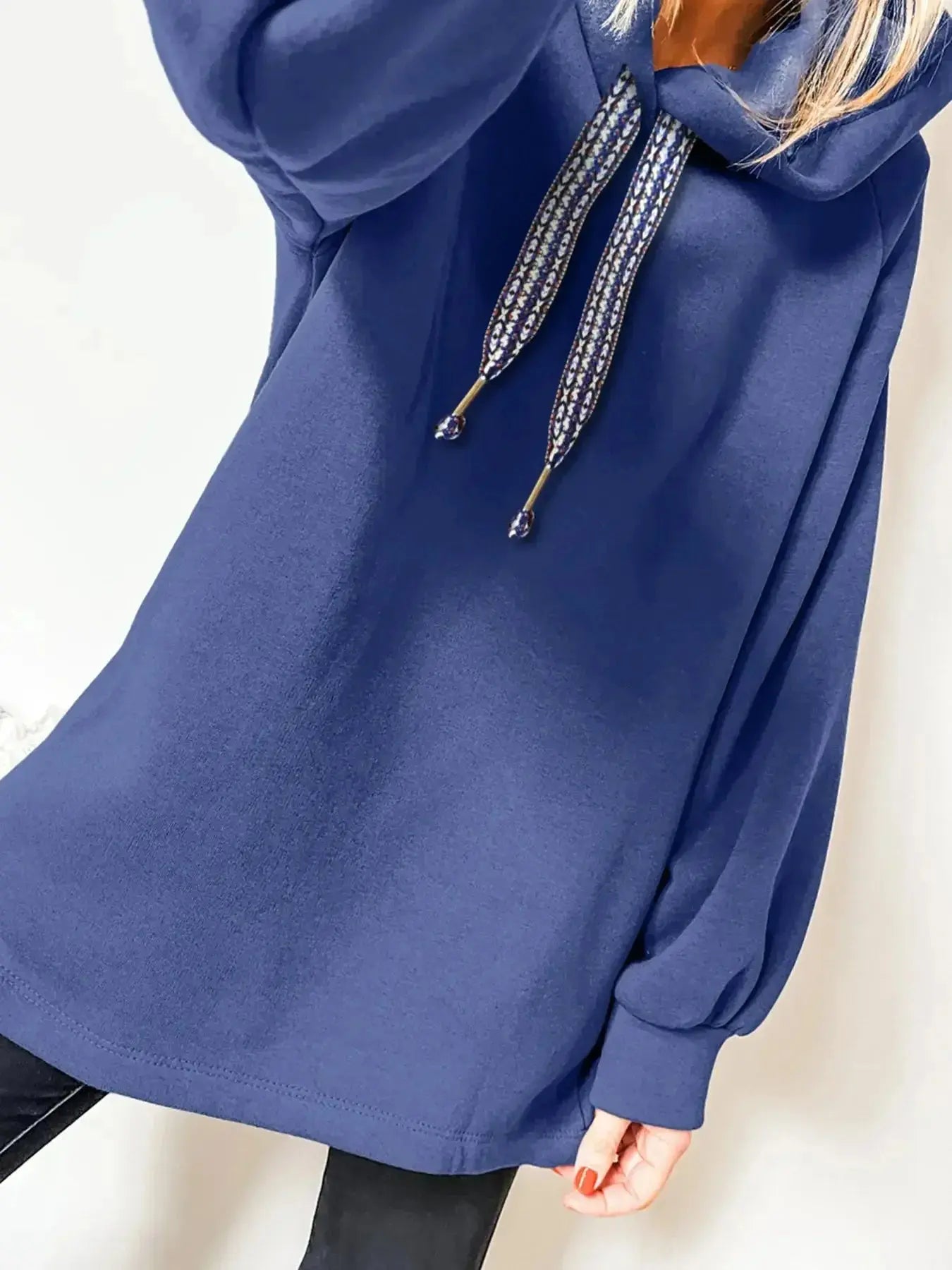 Women’s fleece-lined oversized tunic hoodie with drawstring hood, stylish and cozy trendy hoodie from Trendsi.