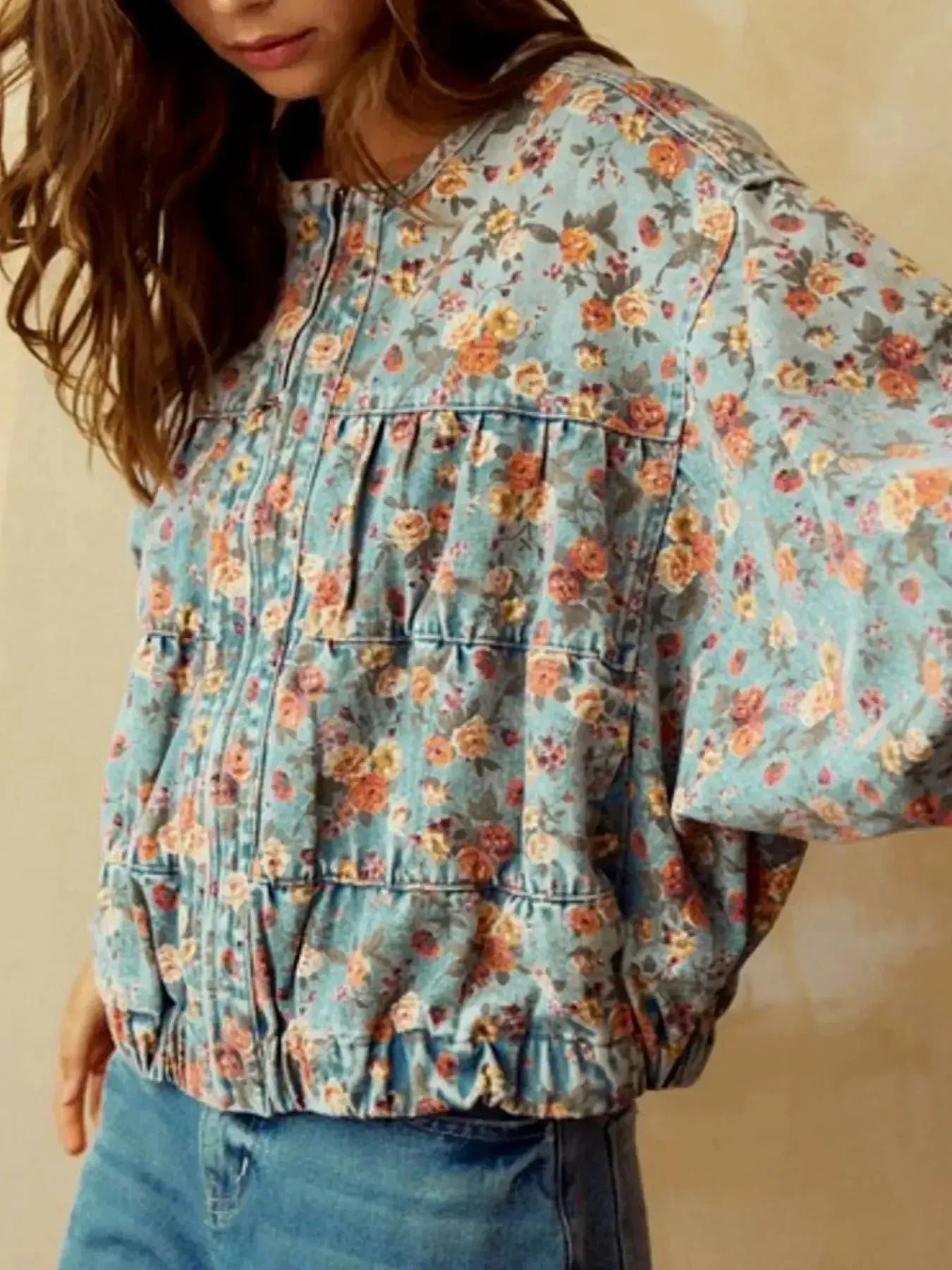 Women's floral print cropped denim jacket with zip-up front and utility design, made from cotton blend fabric by Trendsi.