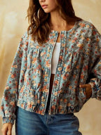 Women's floral print cropped denim jacket with zip-up front, cotton blend utility coat, featuring floral details and a stylish fit.
