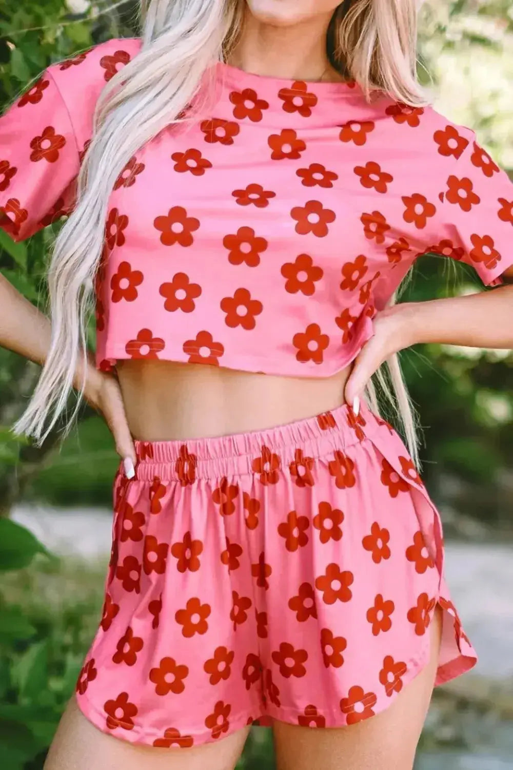 Women's floral print cropped tee and shorts pajama lounge set by Trendsi, featuring a comfortable, stylish sleepwear ensemble.