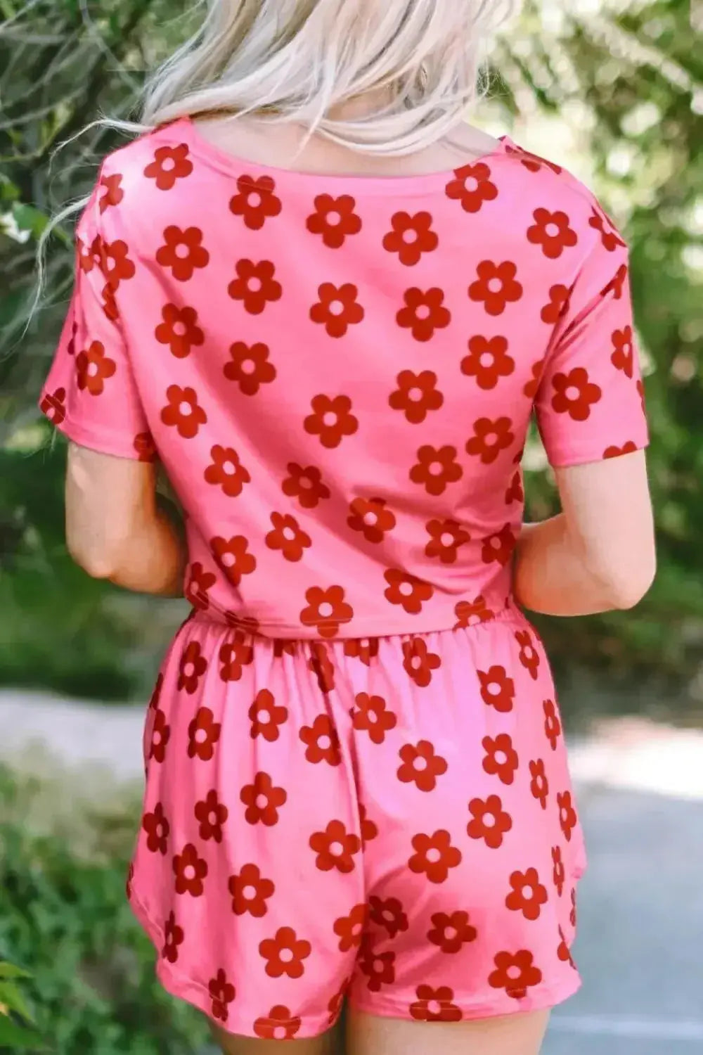 Women’s floral print cropped tee and shorts pajama lounge set by Trendsi, featuring a relaxed fit, soft fabric, and vibrant floral pattern.