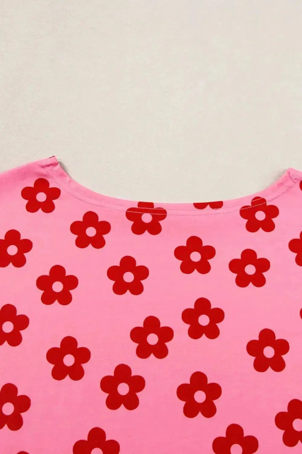 Women's floral print cropped tee and shorts pajama lounge set by Trendsi, featuring a comfortable, stylish sleepwear ensemble.