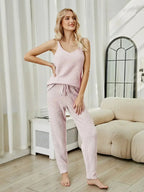 Women’s fuzzy V-neck cami and pants two-piece lounge sleepwear set by Trendsi, featuring soft, cozy fabric and relaxed fit.
