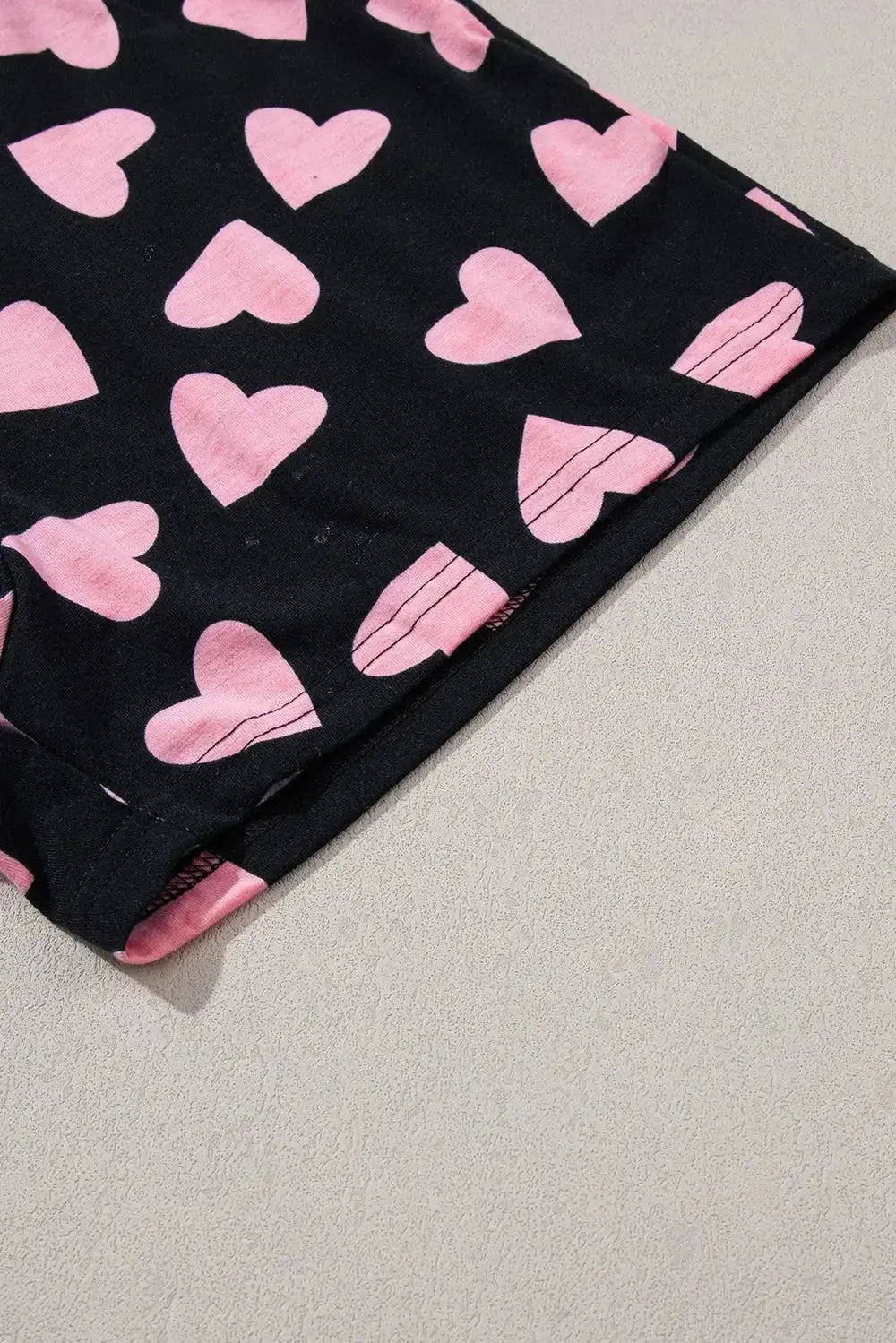 Women's heart print long sleeve pajama set featuring a cozy two-piece plush lounge set by Trendsi.