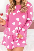 Women's heart print long sleeve pajama set with elastic waist shorts, comfortable sleepwear by Trendsi.