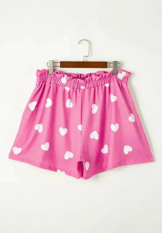 Women’s heart print long sleeve pajama set with elastic waist shorts, stylish and comfortable sleepwear from Trendsi.