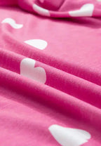 Women's heart print long sleeve pajamas set with elastic waist shorts from Trendsi, featuring a cozy, comfortable design.