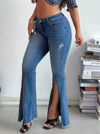 Women’s high-rise distressed slit flare jeans in vintage-inspired denim, featuring a fitted waist and wide flare legs.