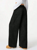 Women’s high-waisted wide-leg lounge pants with drawstring waist, casual and comfortable wear from Trendsi.