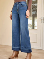 Women's high-waisted wide-leg washed denim jeans with classic relaxed fit, displayed on a model.