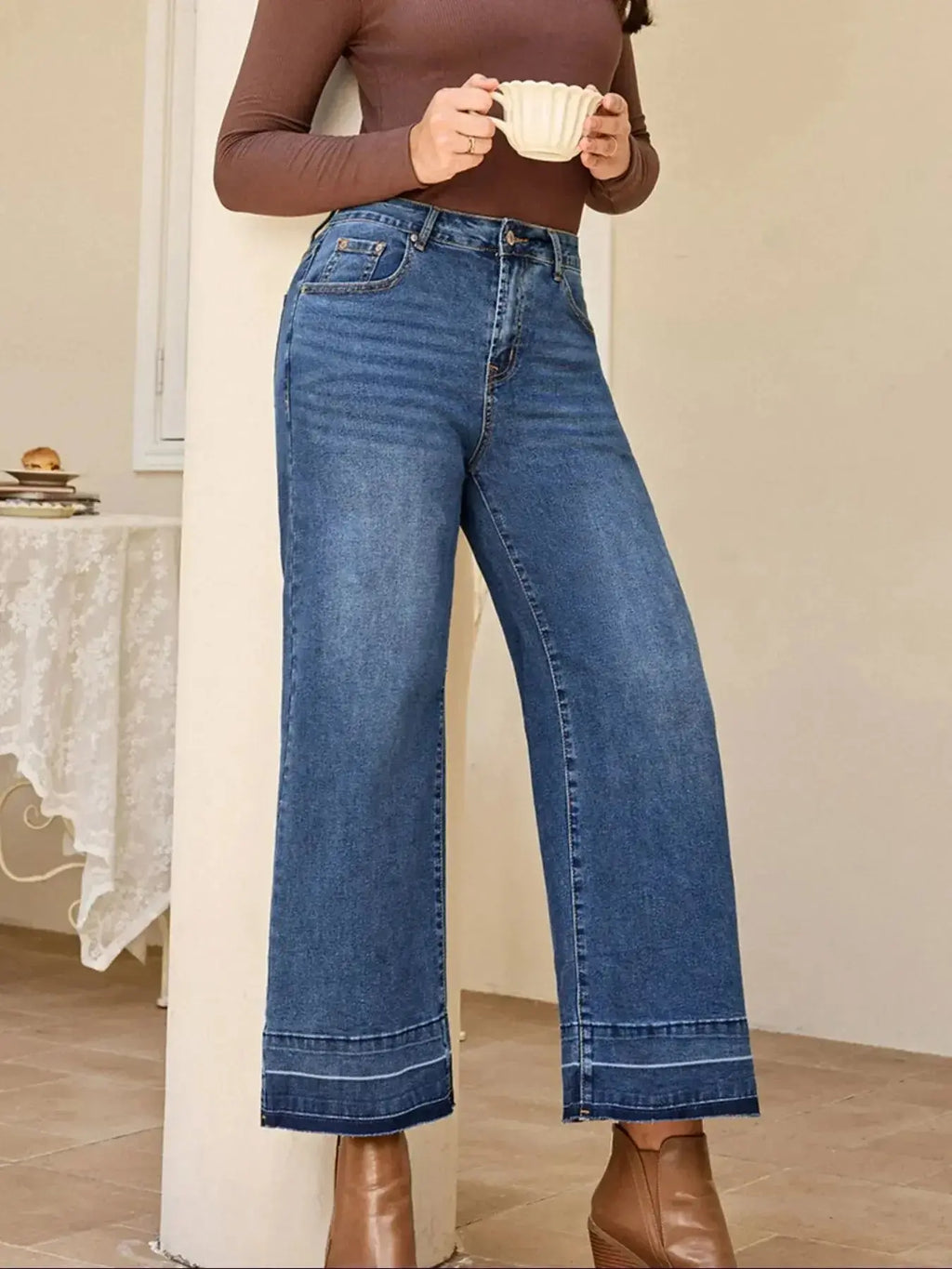 Women’s high-waisted wide-leg washed denim jeans with a relaxed fit, featuring classic styling and Trendsi branding.