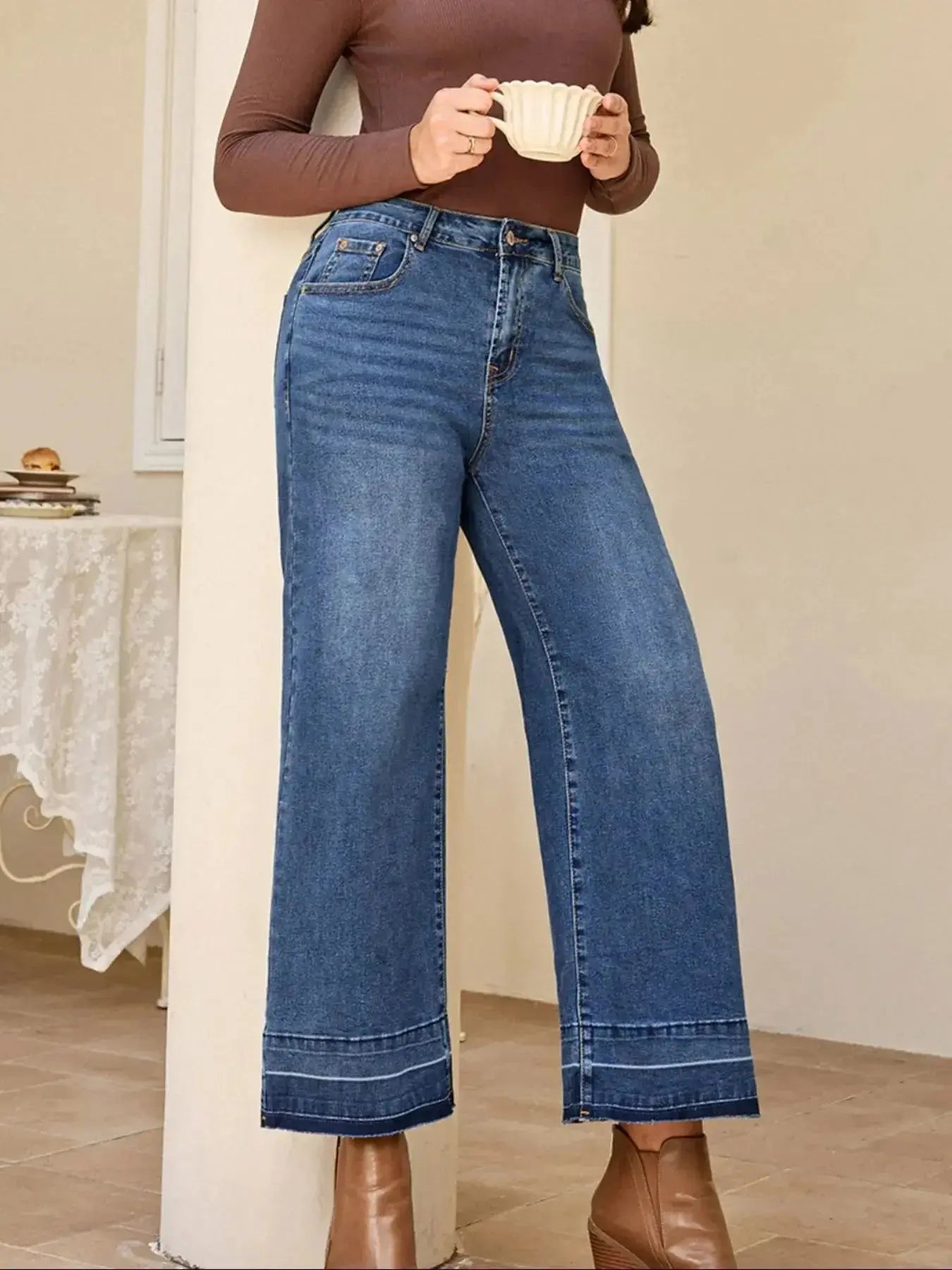 Women’s high-waisted wide-leg washed denim jeans with a relaxed fit, featuring classic styling and Trendsi branding.