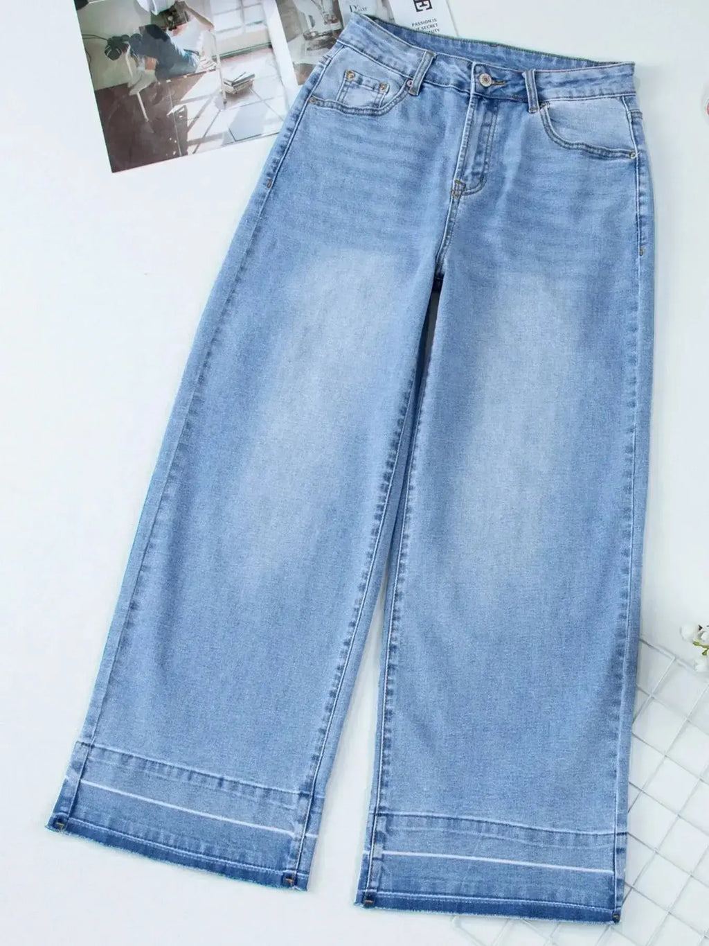 Women’s high-waisted wide-leg washed denim jeans with a relaxed fit, featuring classic style and trendy denim look.