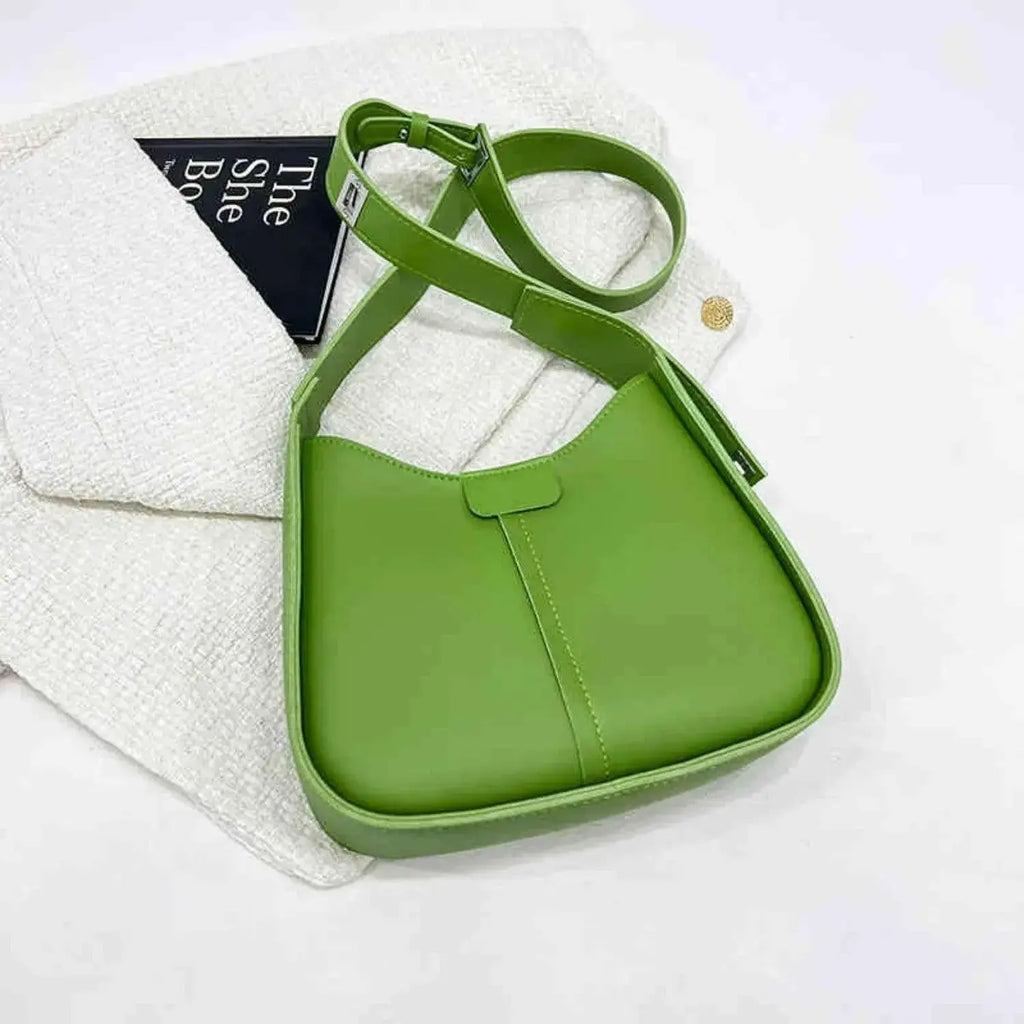 Women's textured vegan leather crossbody handbag with a sleek design, versatile shoulder purse from Plush Fashion Hub.