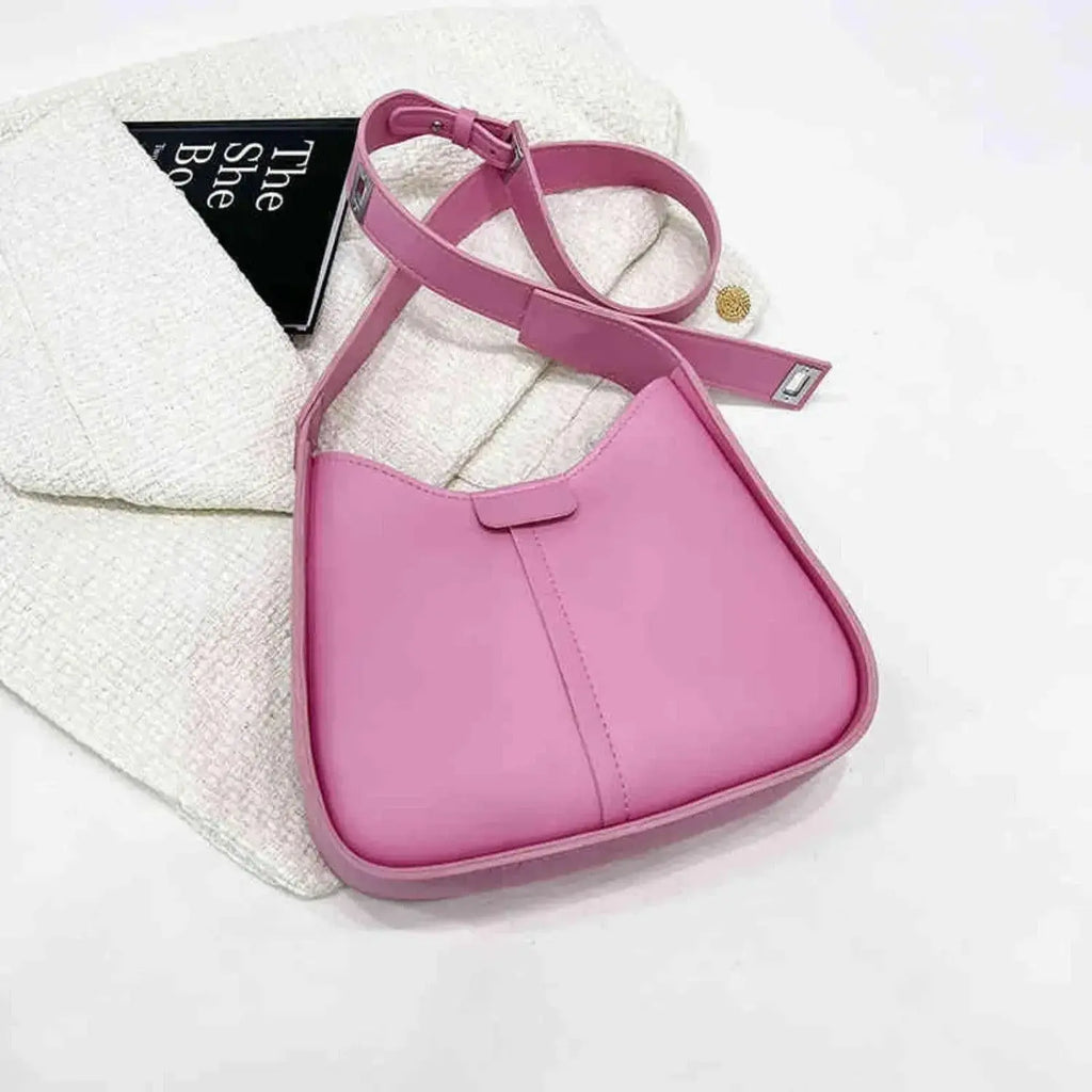 Women’s textured vegan leather crossbody handbag with a versatile shoulder strap, by Plush Fashion Hub.