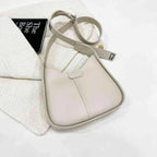 Women's textured vegan leather crossbody handbag with versatile shoulder strap, stylish and high-end design from Plush Fashion Hub.