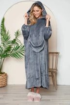 Women’s hooded midi lounge dress with pockets, soft plush fabric, stylish sleepwear from Trendsi in a comfortable pajama style.