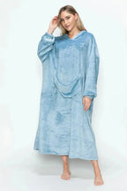 Women’s hooded midi lounge dress with pockets, soft plush fabric, from Trendsi, ideal for cozy pajama or loungewear comfort.