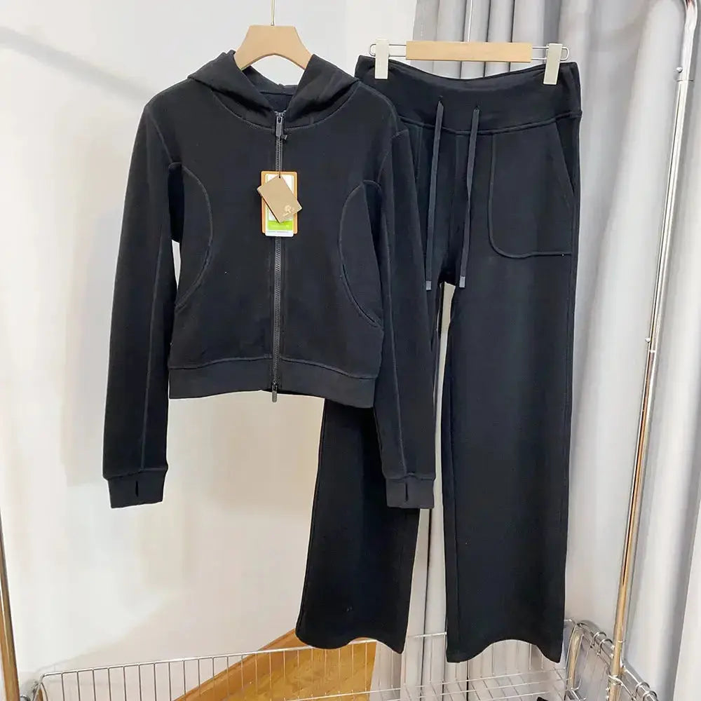 Women's hooded sweatshirt and wide-leg pants lounge set by Plush Fashion Hub, featuring cozy, stylish sweatpants and hoodie ensemble.