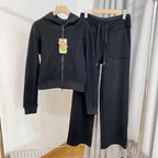 Women's hooded sweatshirt and wide-leg pants lounge set by Plush Fashion Hub, featuring cozy, stylish sweatpants and hoodie ensemble.