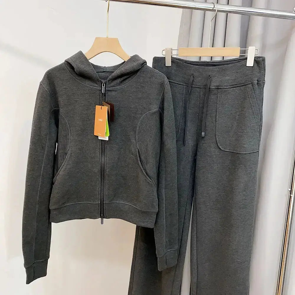 Women's hooded sweatshirt and wide-leg pants lounge set by Plush Fashion Hub, featuring soft fabric and relaxed fit.