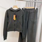 Women's hooded sweatshirt and wide-leg pants lounge set by Plush Fashion Hub, featuring soft fabric and relaxed fit.