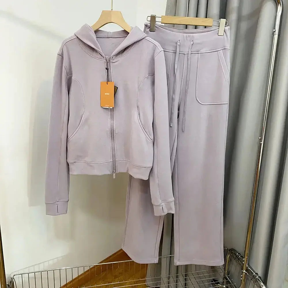 Women's hooded sweatshirt and wide-leg pants lounge set by Plush Fashion Hub, featuring a cozy, stylish sweatsuit design.