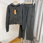 Women wearing Plush Fashion Hub hooded sweatshirt and wide-leg pants lounge set, showcasing comfortable, stylish sweatsuits.