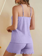 Women's lace-trimmed ribbed cami and shorts pajama lounge set by Trendsi, featuring soft fabric and delicate lace details.