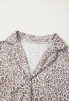 Women's leopard print long sleeve pajama lounge set by Trendsi, featuring a button-down top and comfortable matching pants.