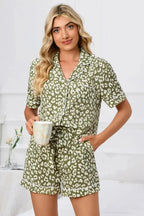 Women's leopard print button-down short sleeve pajama lounge set by Trendsi, featuring a comfortable and stylish pajama top and shorts.