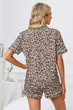 Women's leopard print pajama lounge set with button-down short sleeves, comfortable and stylish sleepwear by Trendsi.