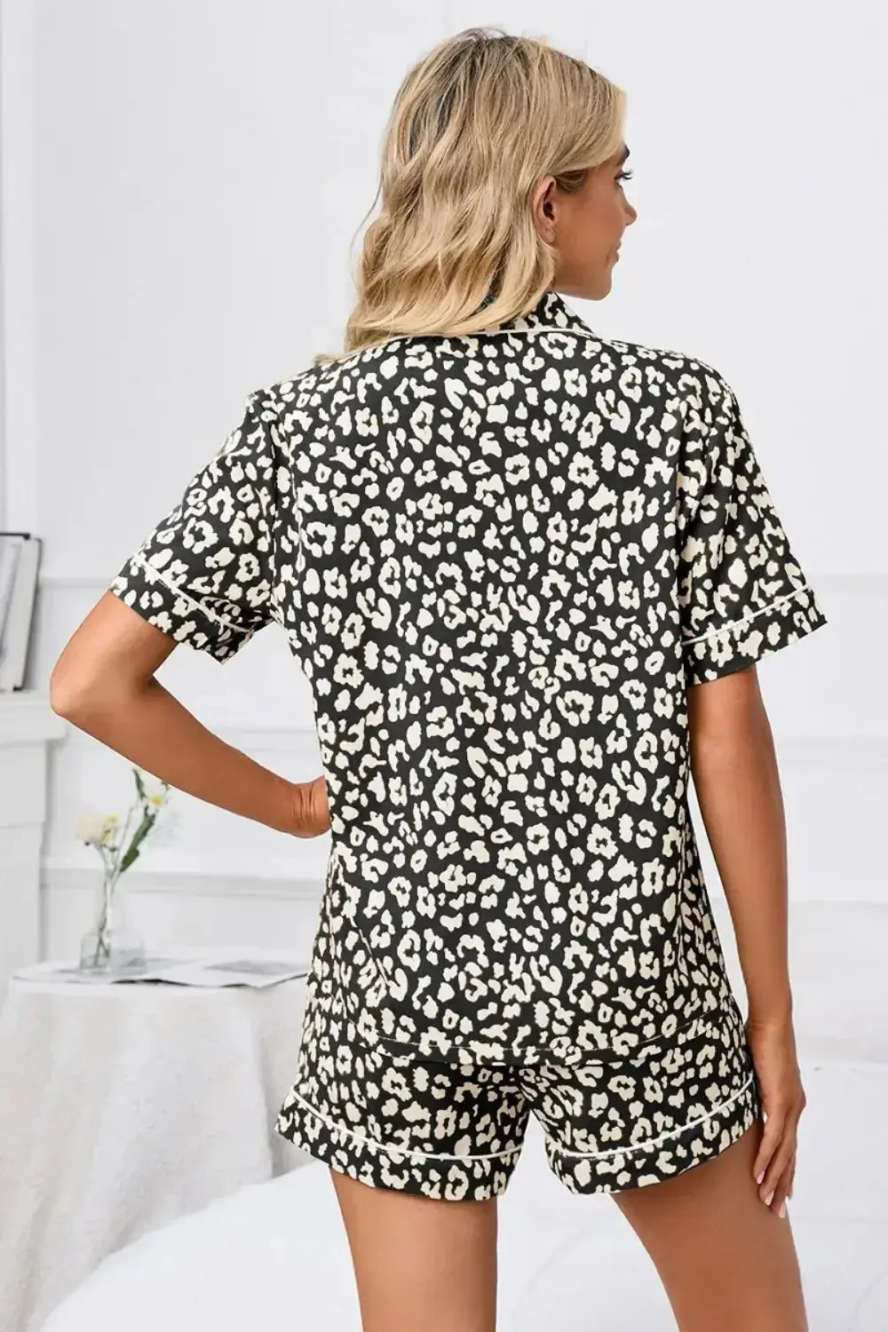 Women's leopard print pajama lounge set with button-down short sleeves, made by Trendsi, featuring a comfortable, stylish design