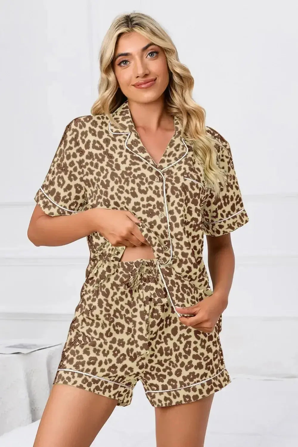 Women's leopard print button-down short sleeve pajama lounge set by Trendsi, featuring a comfortable, stylish design.