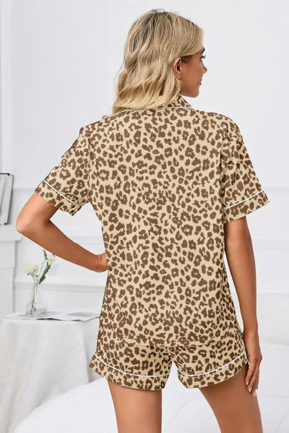 Women’s leopard print button-down short sleeve pajamas lounge set by Trendsi, featuring a comfortable and stylish sleepwear design.