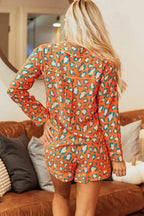 Women's leopard print pajama lounge set with collared long sleeve top and matching shorts from Trendsi
